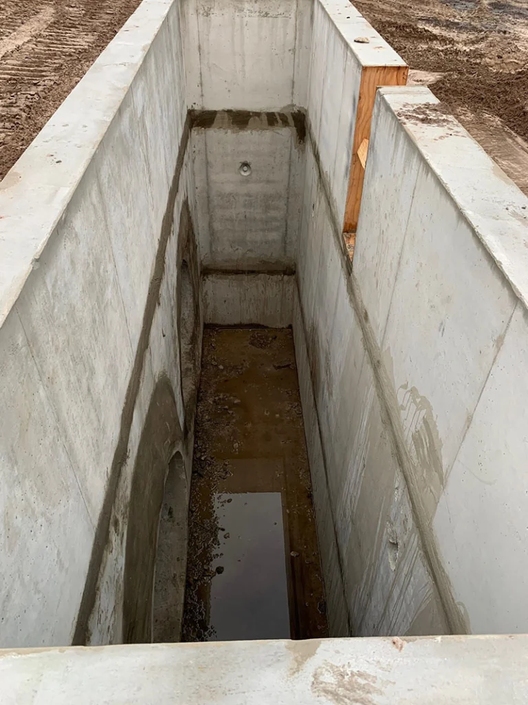Image a pre-cast manhole being installed