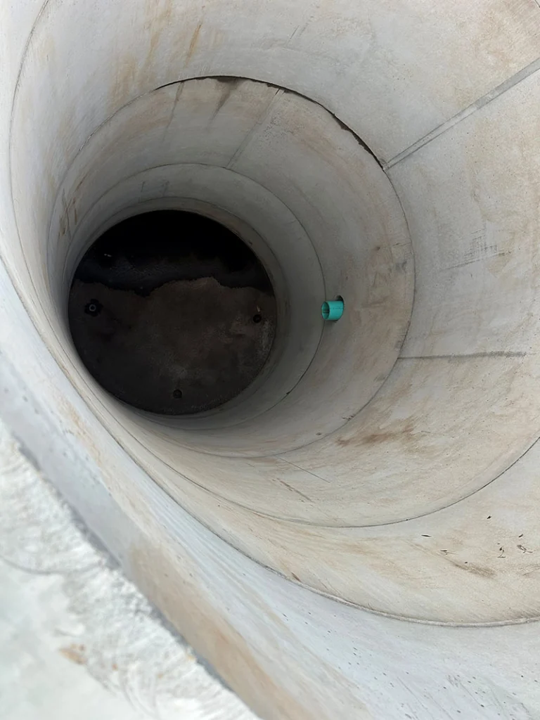 Image a pre-cast manhole being installed