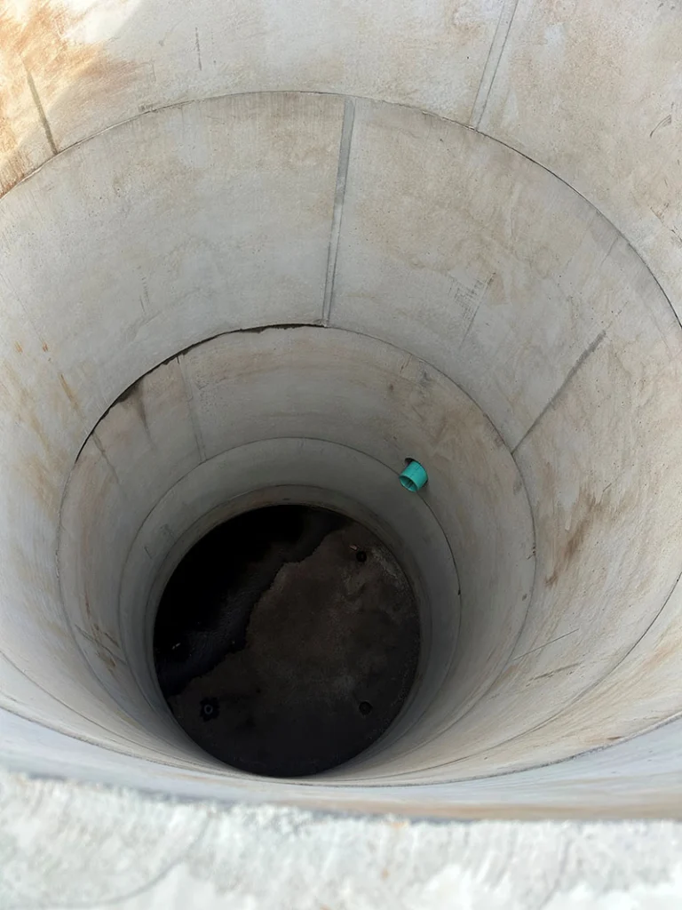 Image a pre-cast manhole being installed