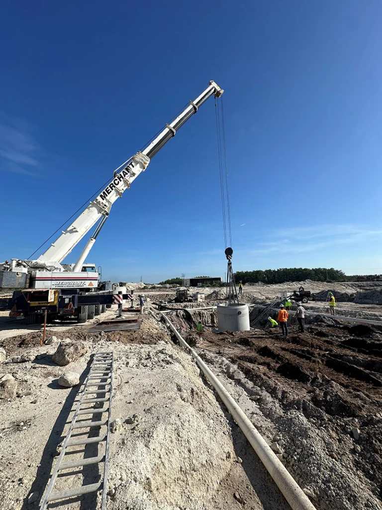 Image a pre-cast manhole being installed