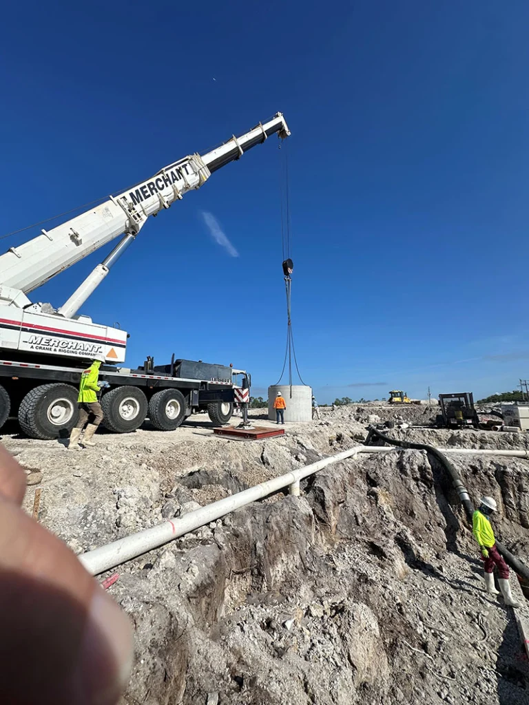 Image a pre-cast manhole being installed