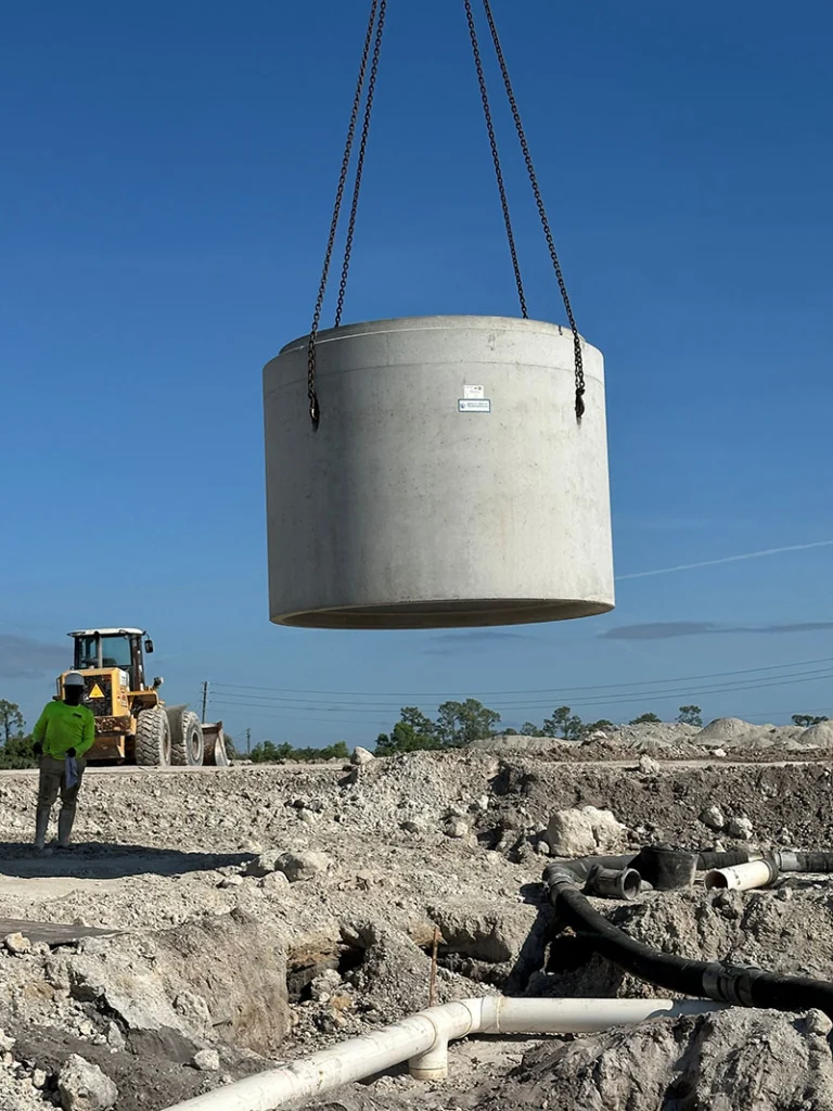 Image a pre-cast manhole being installed