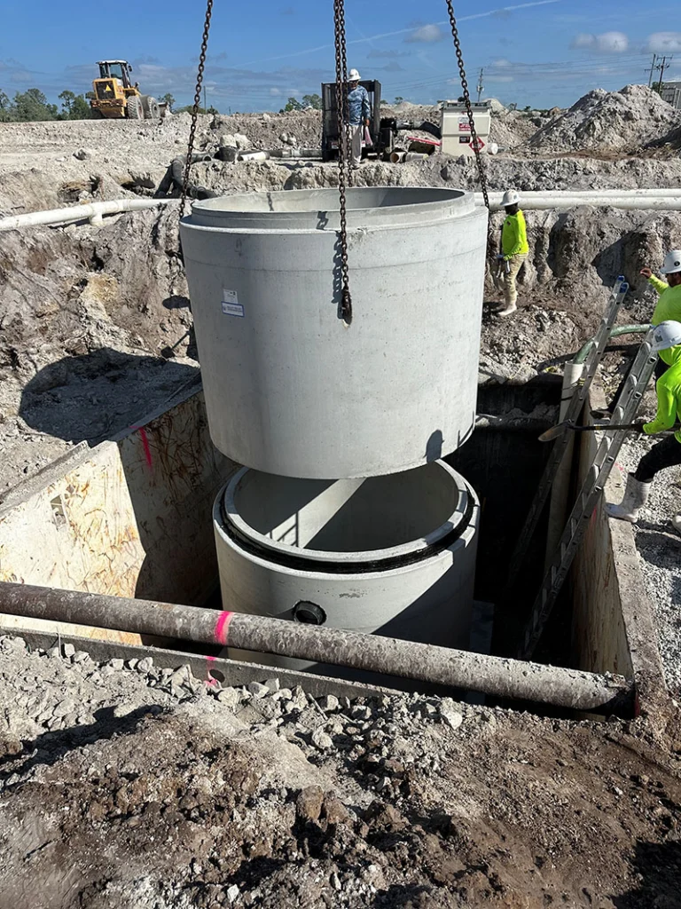 Image a pre-cast manhole being installed