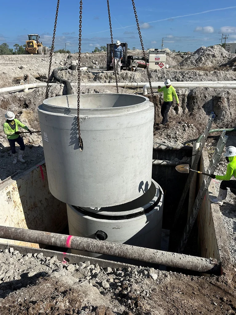 Image a pre-cast manhole being installed