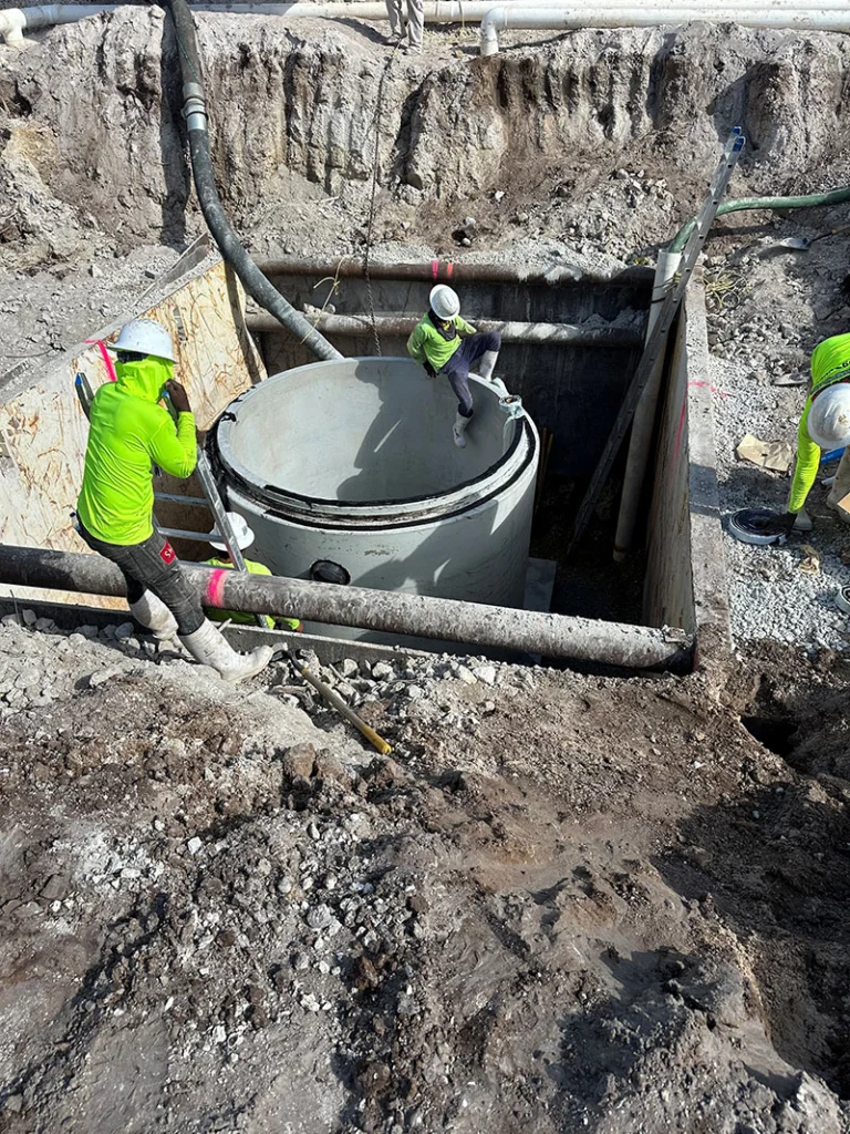 Image a pre-cast manhole being installed