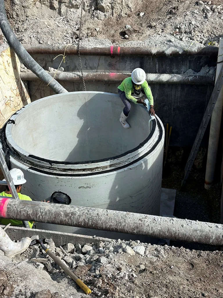 Image a pre-cast manhole being installed