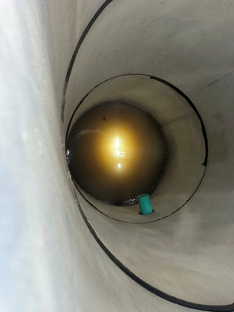 Image a pre-cast manhole being installed