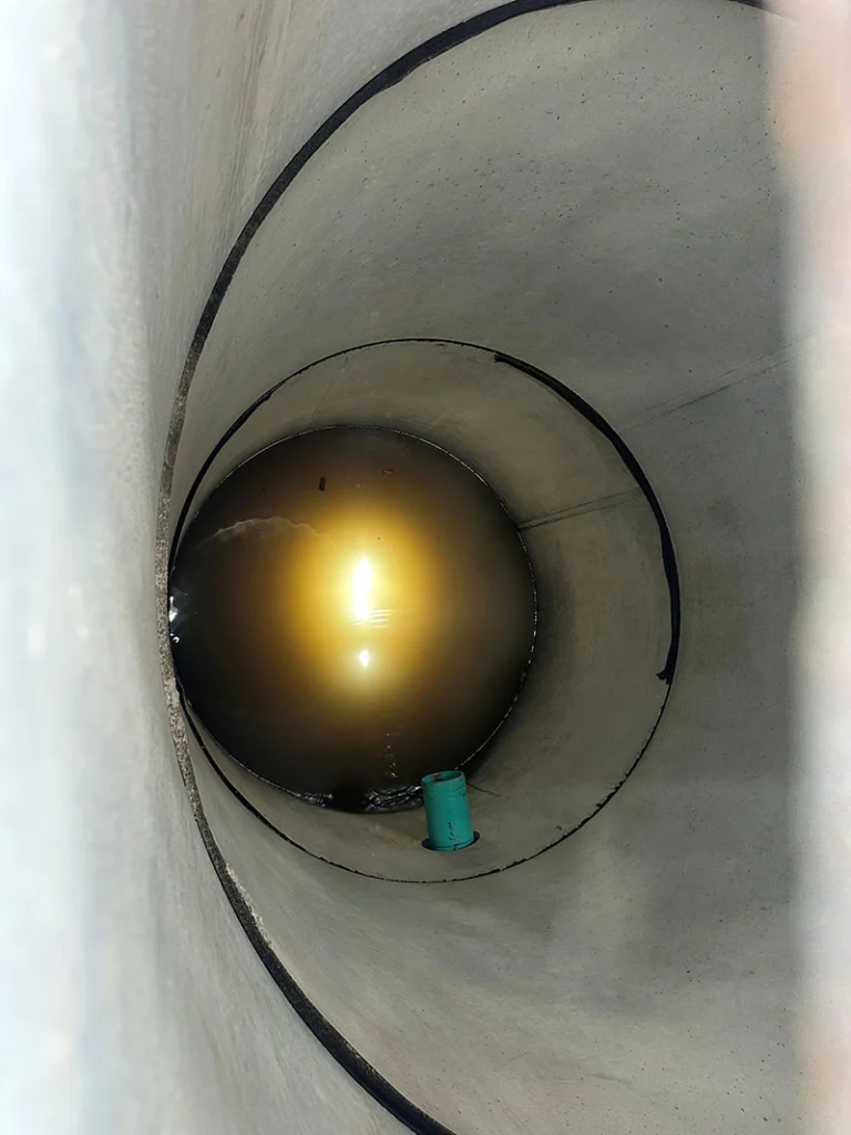 Image a pre-cast manhole being installed