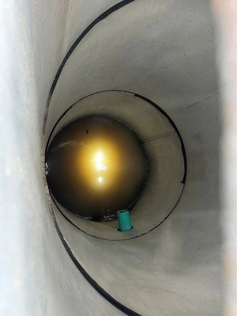 Image a pre-cast manhole being installed