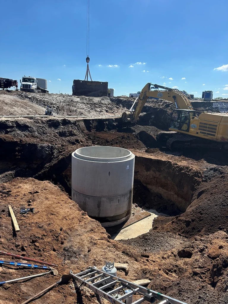Image a pre-cast manhole being installed